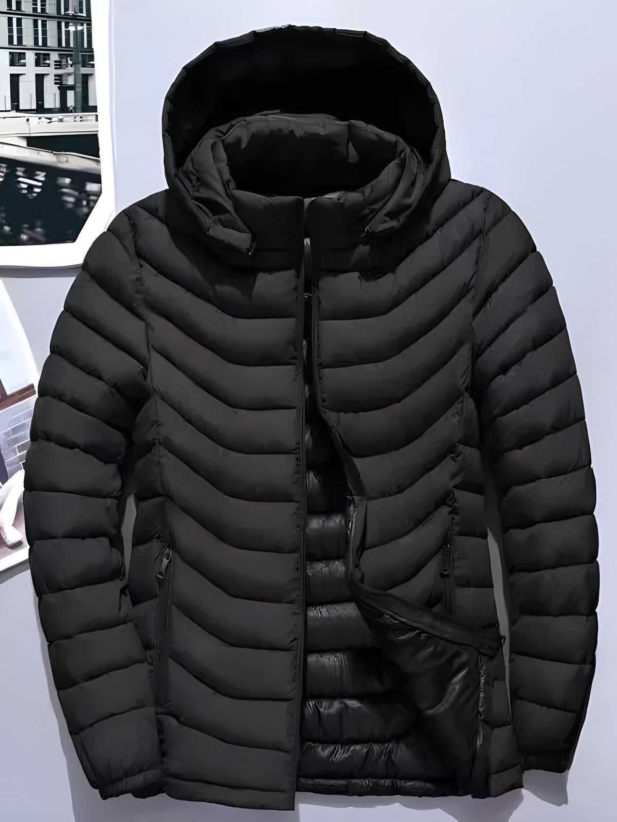 Side view of a men's quilted jacket with hood