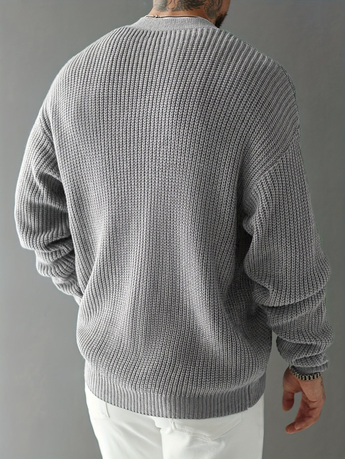 Side view of a women’s chunky ribbed cardigan