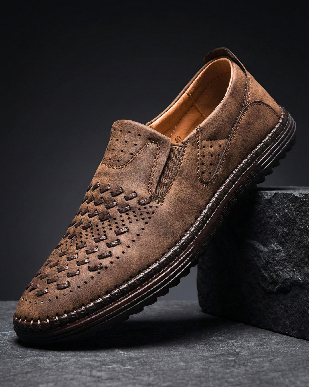 Pair of classic brown leather loafers displayed against a clean background