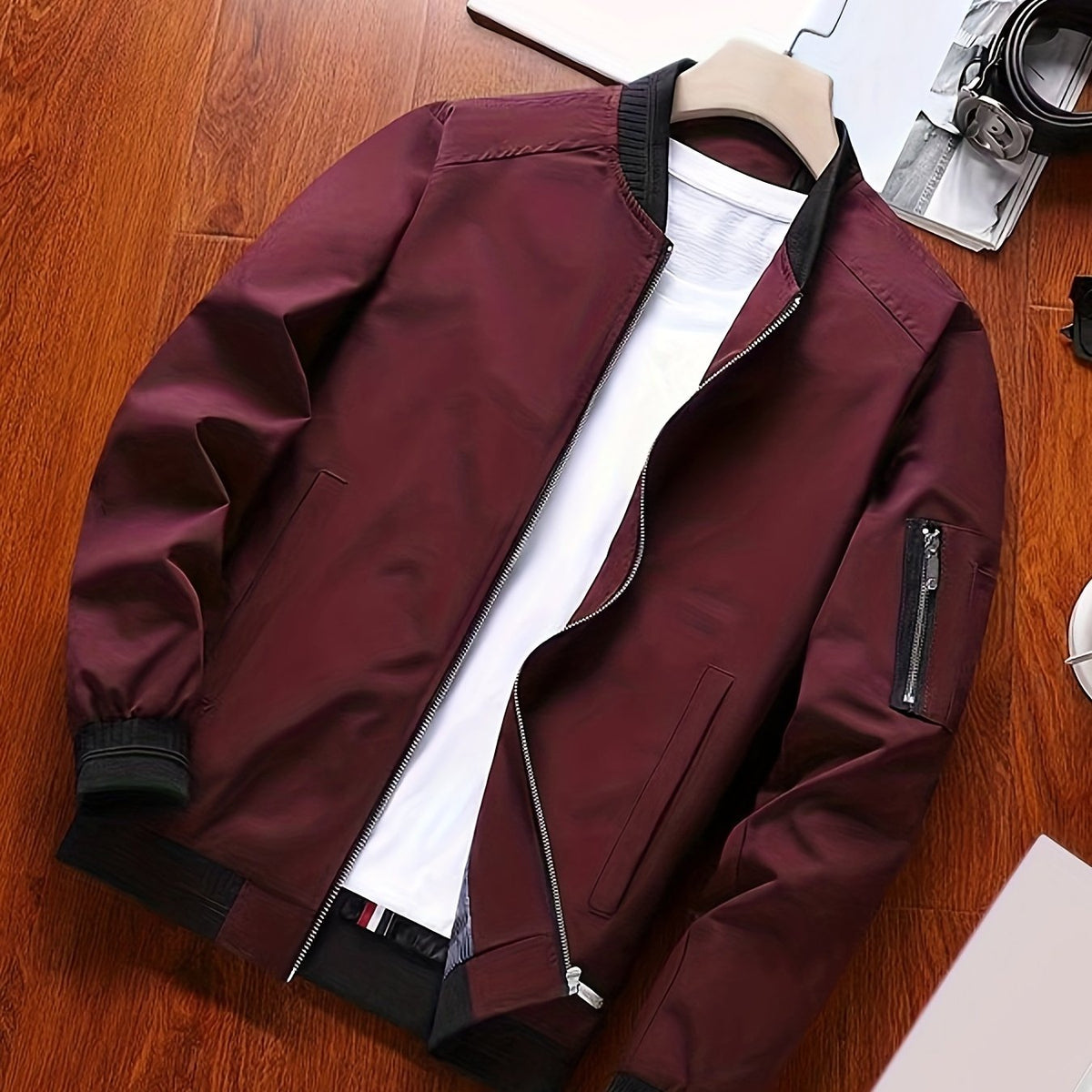 Full view of the classic bomber jacket on a simple product display.