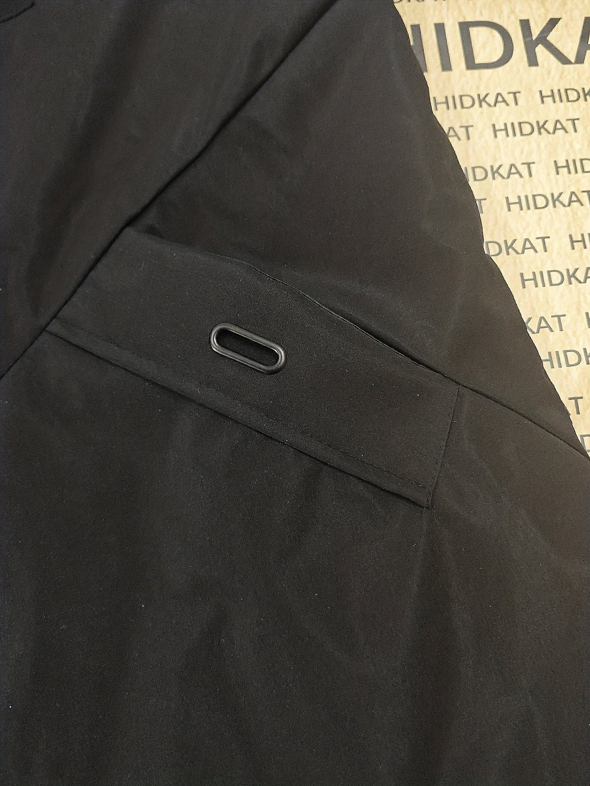 Front closure detail on a men's hooded parka