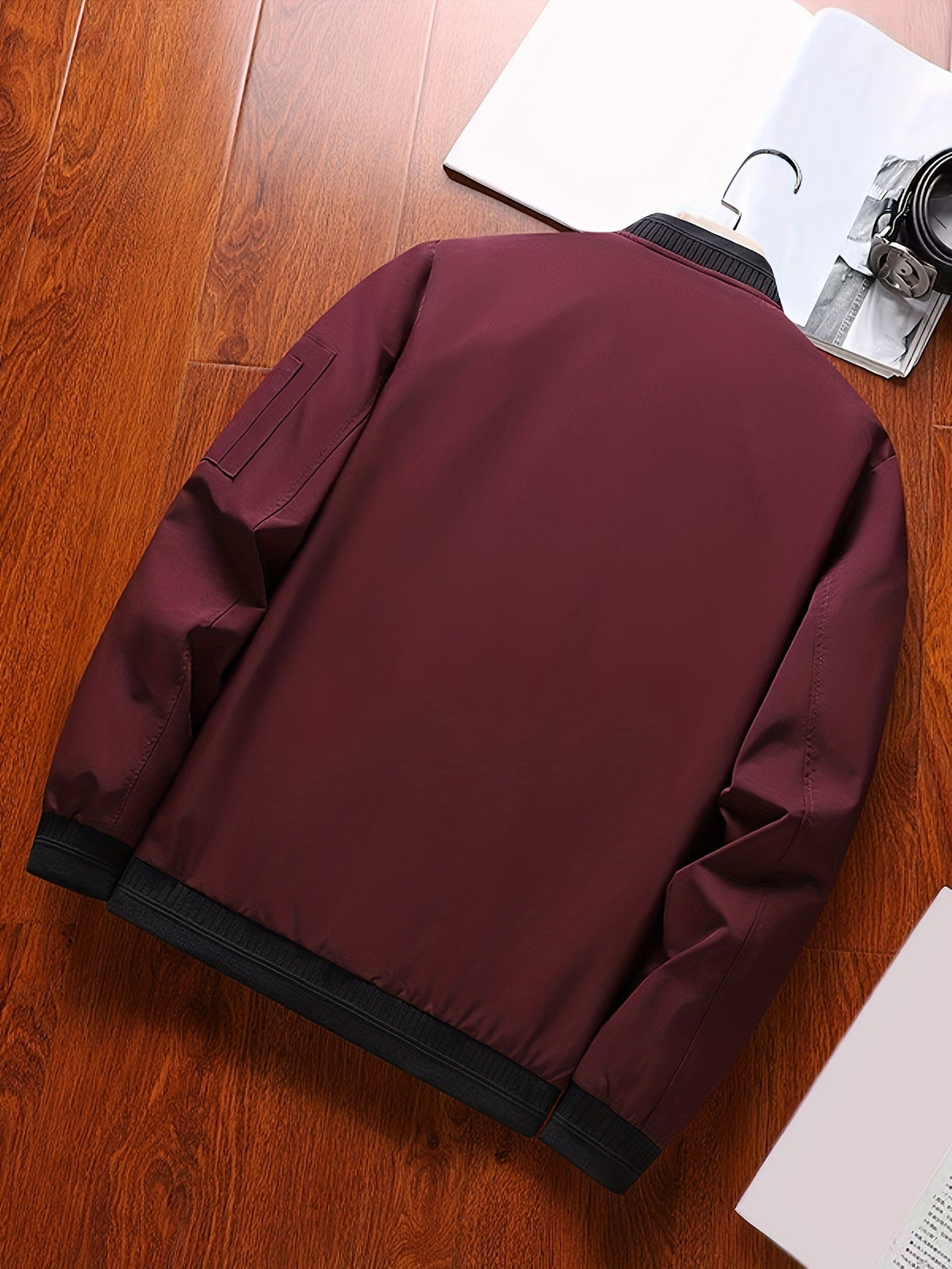 Detailed view of the classic bomber jacket front and sleeve design.