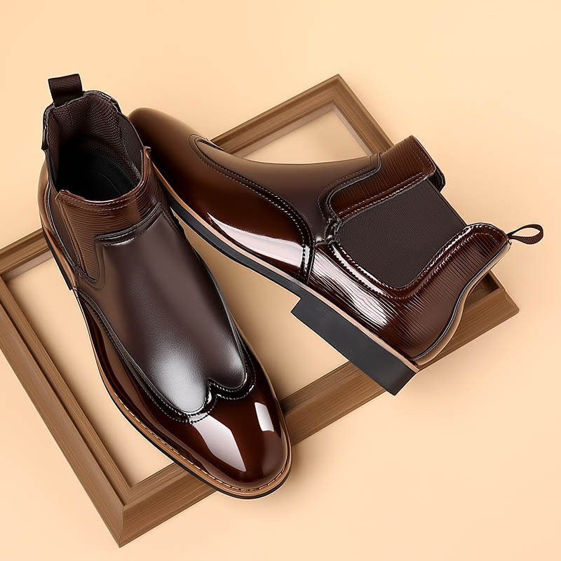 Pair of men's Chelsea boots displayed at an angle
