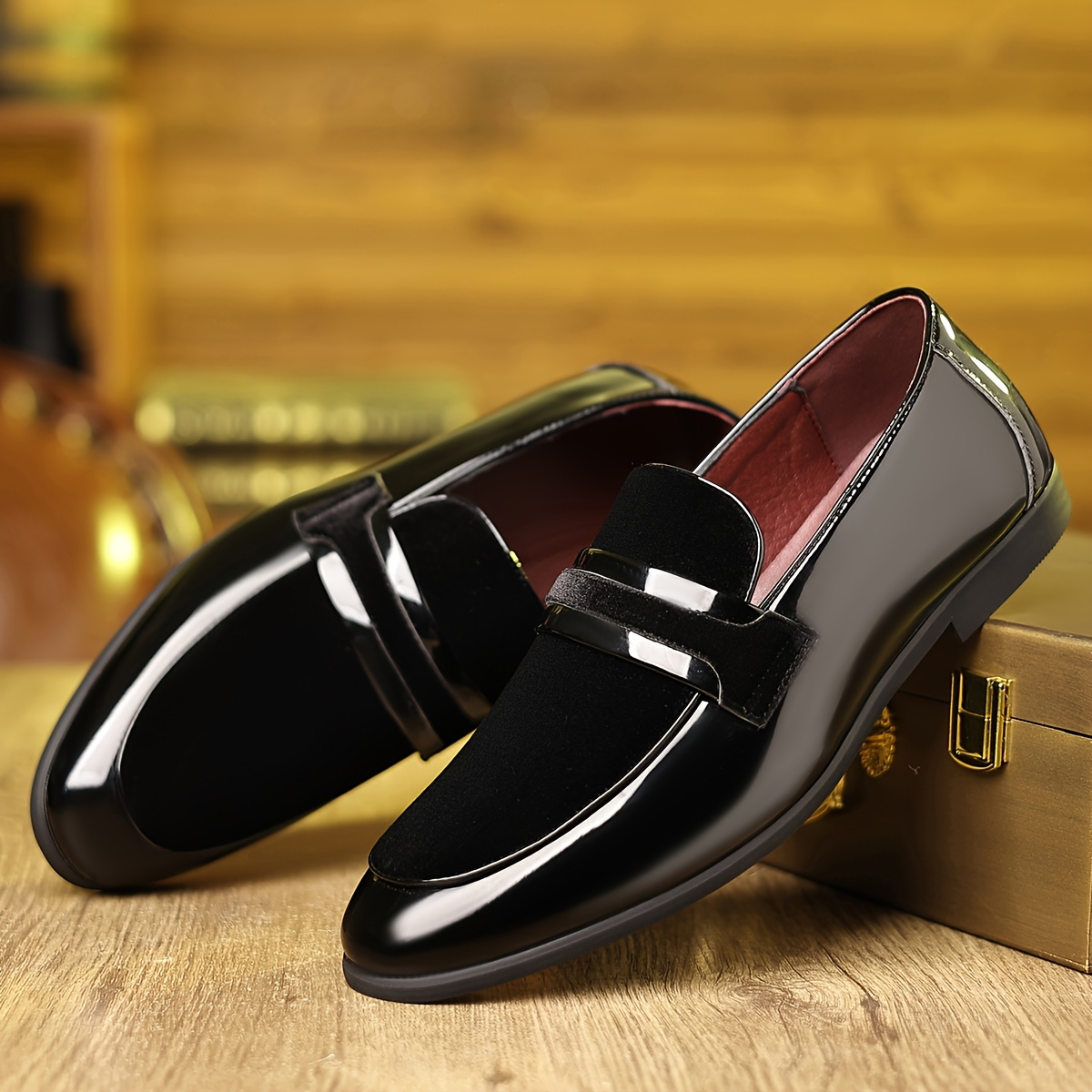 Side view of patent leather contrast panel loafers