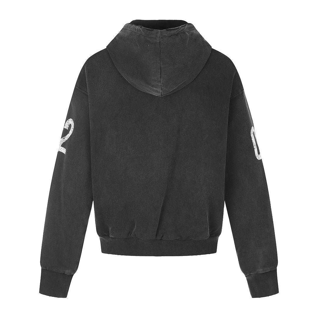 Close-up of the distressed number graphic on the zip-up hoodie