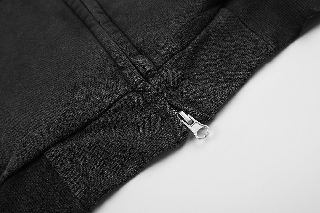 Detail view of the hoodie zipper and distressed graphic print