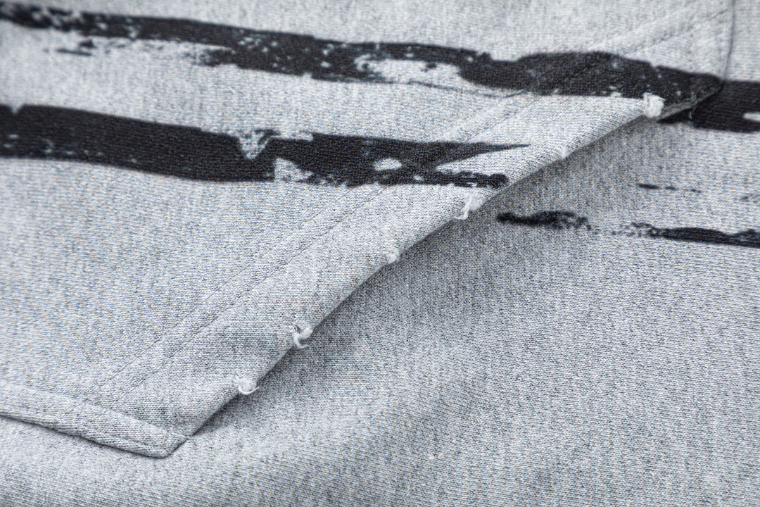 Ribbed cuffs on the distressed graphic hoodie