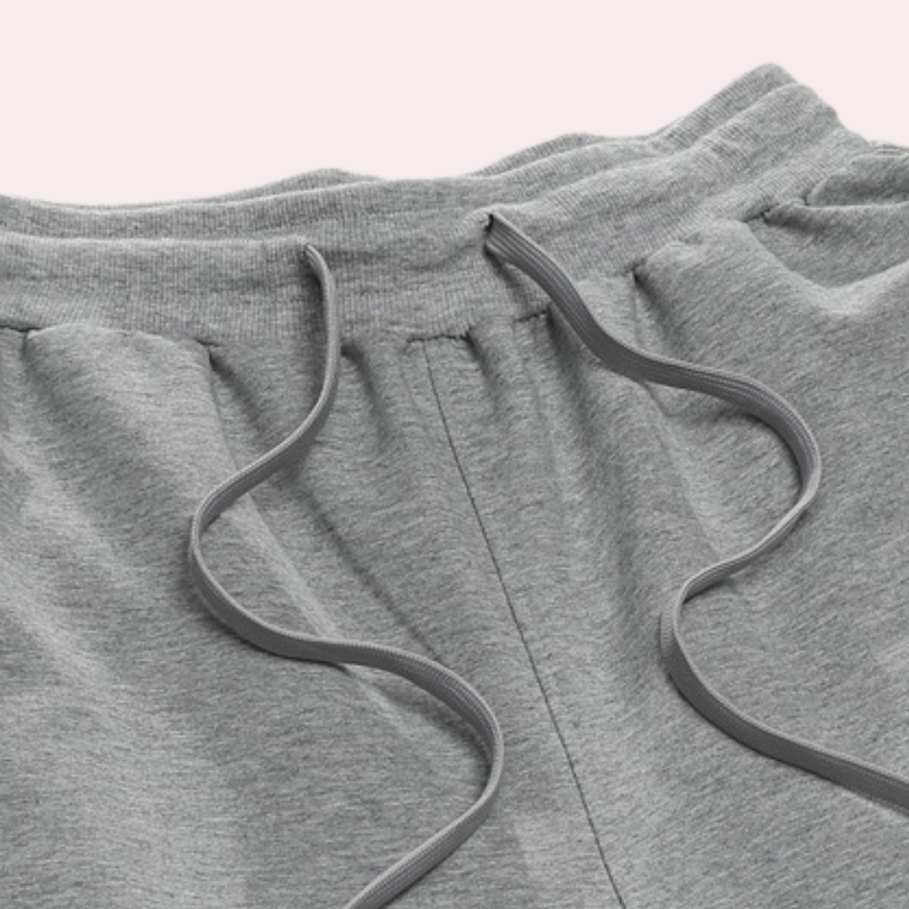 Detail view of the waistband and drawstring on men's jogger pants