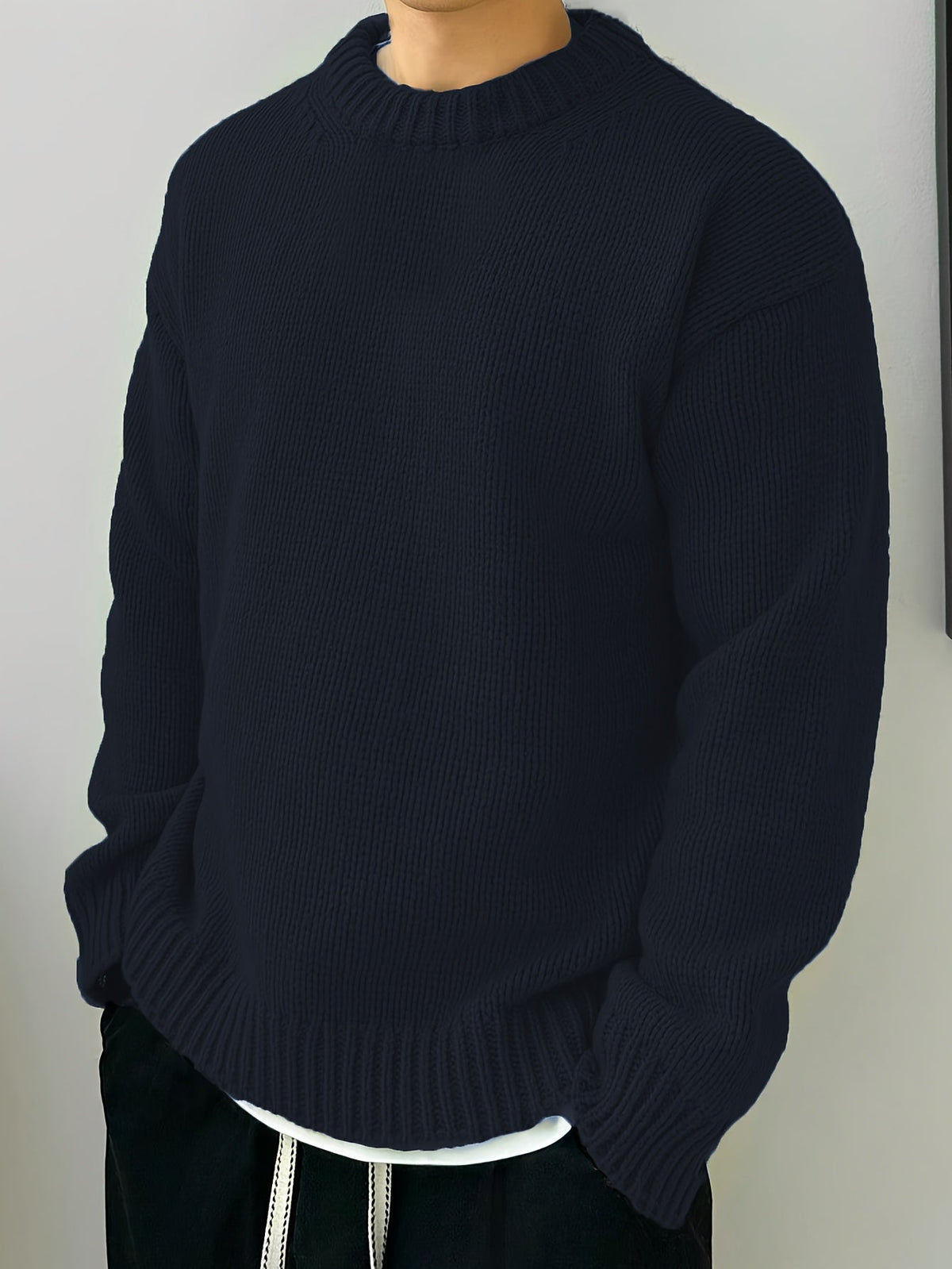 Textured pullover sweater showing ribbed neckline