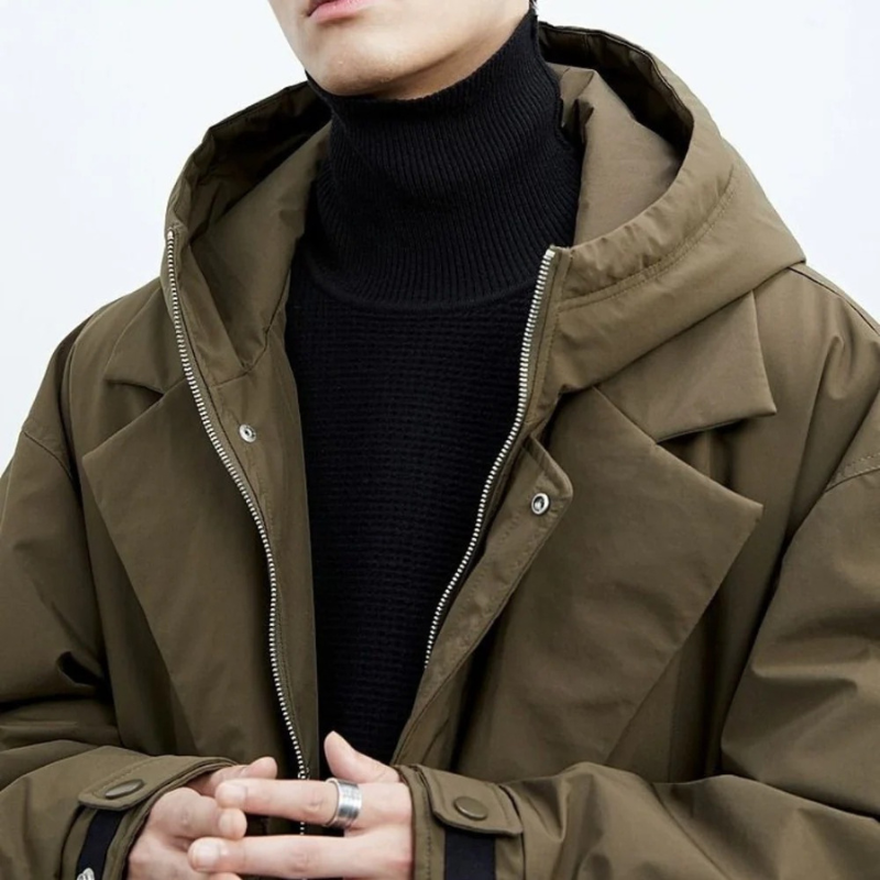 Belted men's winter trench coat displaying its long tailored silhouette