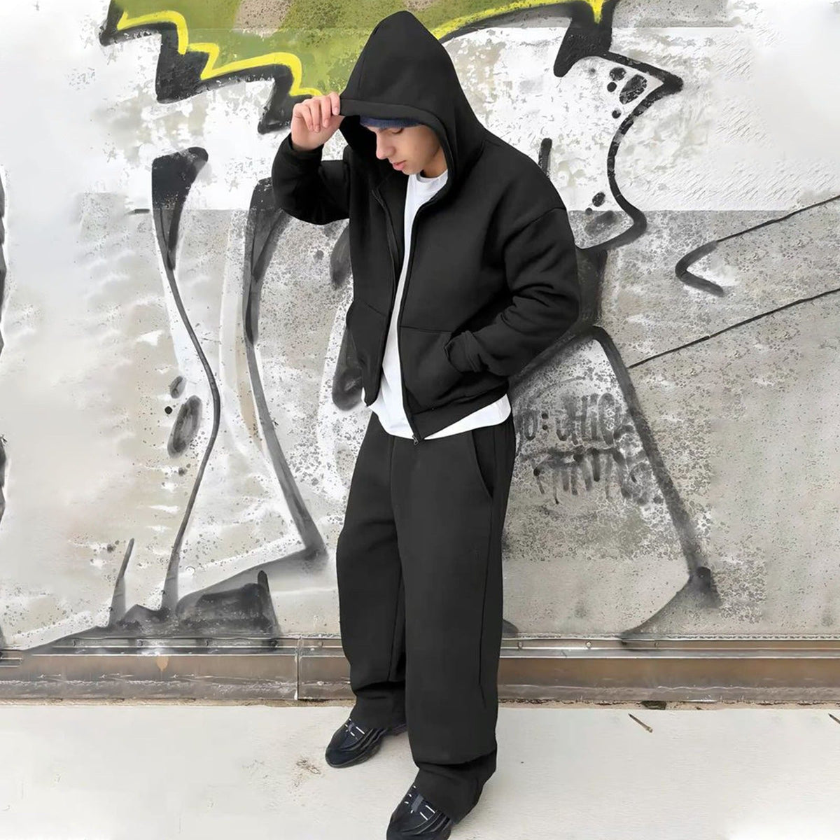 Side view of men's oversized hoodie and relaxed sweatpants