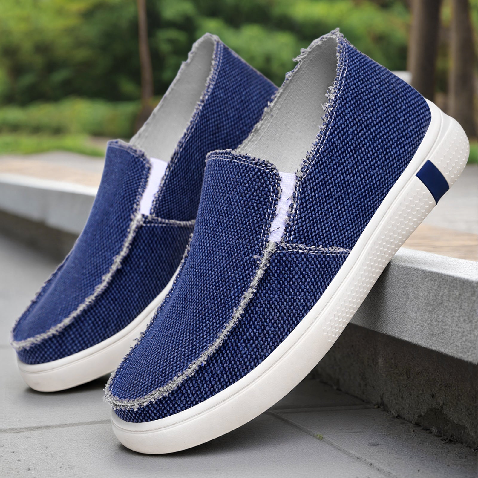 Men's canvas slip-on sneakers with a frayed edge