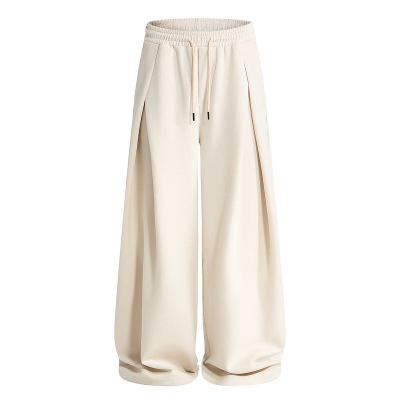 Close-up of the pleated detail on baggy sweatpants