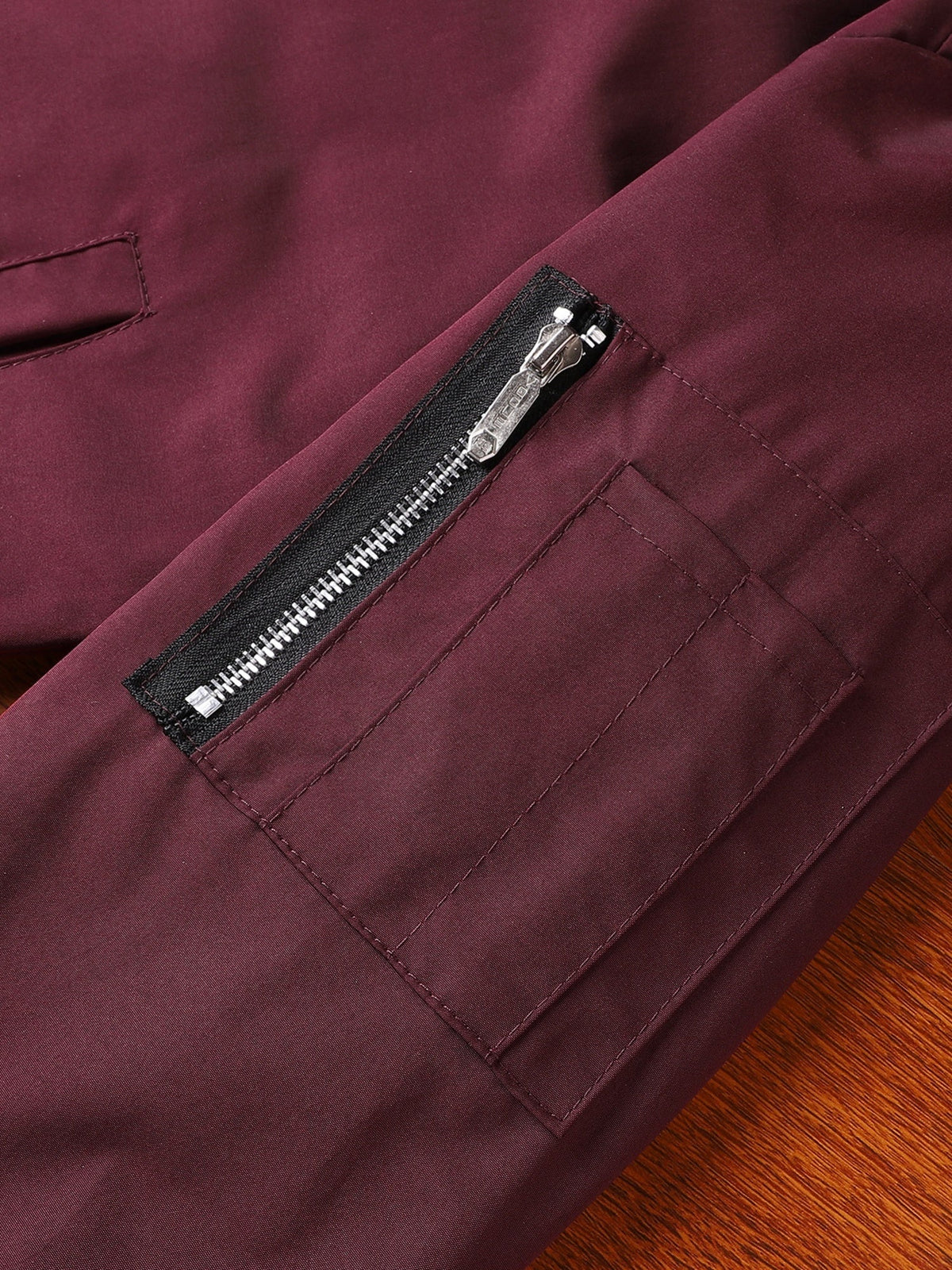 Classic bomber jacket shown as a versatile outerwear choice for casual occasions.