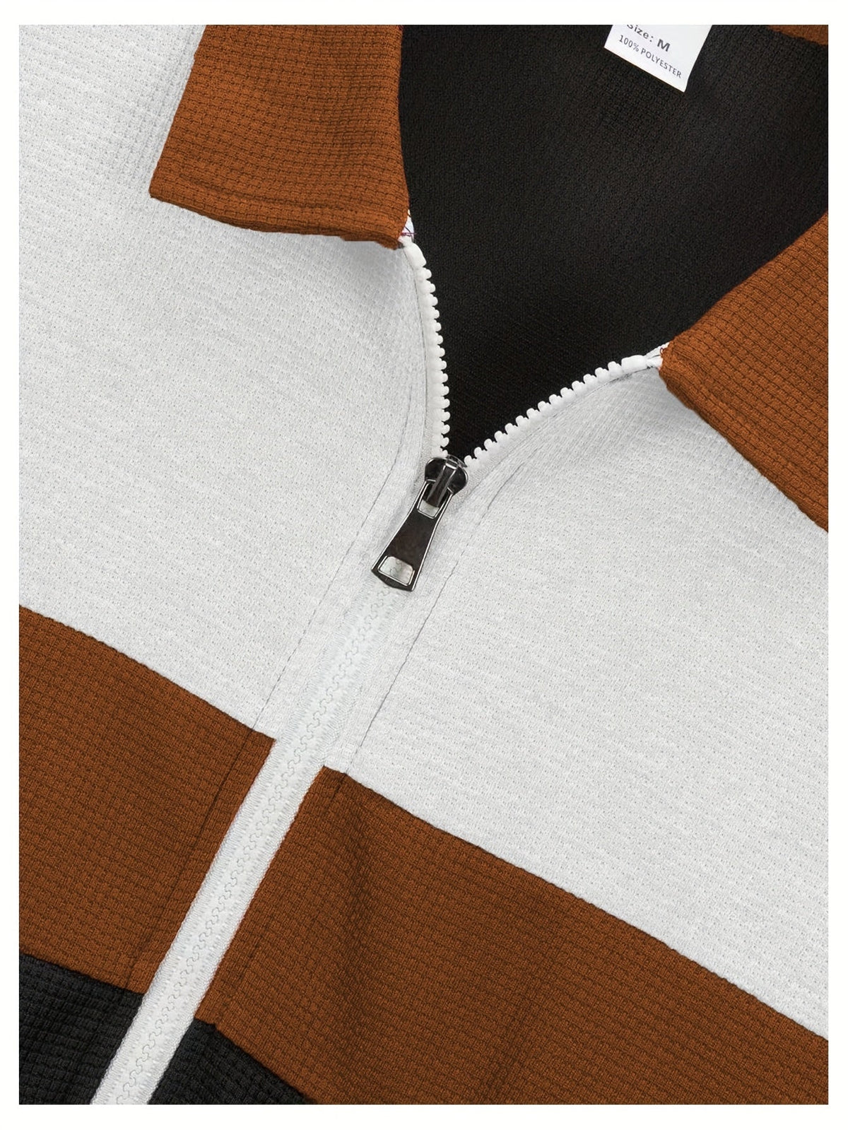 Close-up of the colorblock design and zip front