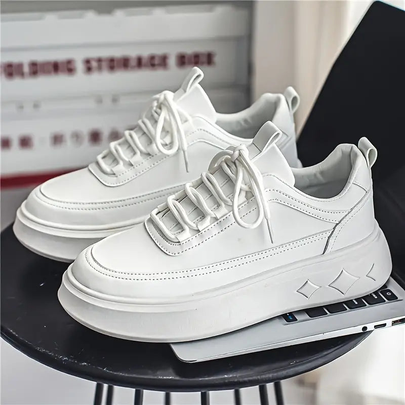 Pair of leather sneakers displayed together