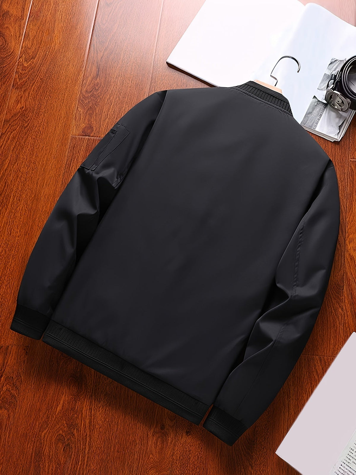 Side view of the classic bomber jacket highlighting its everyday shape.