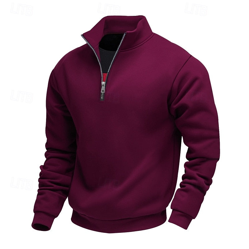 Detail view of the cuffs and hem on a men's quarter-zip sweater