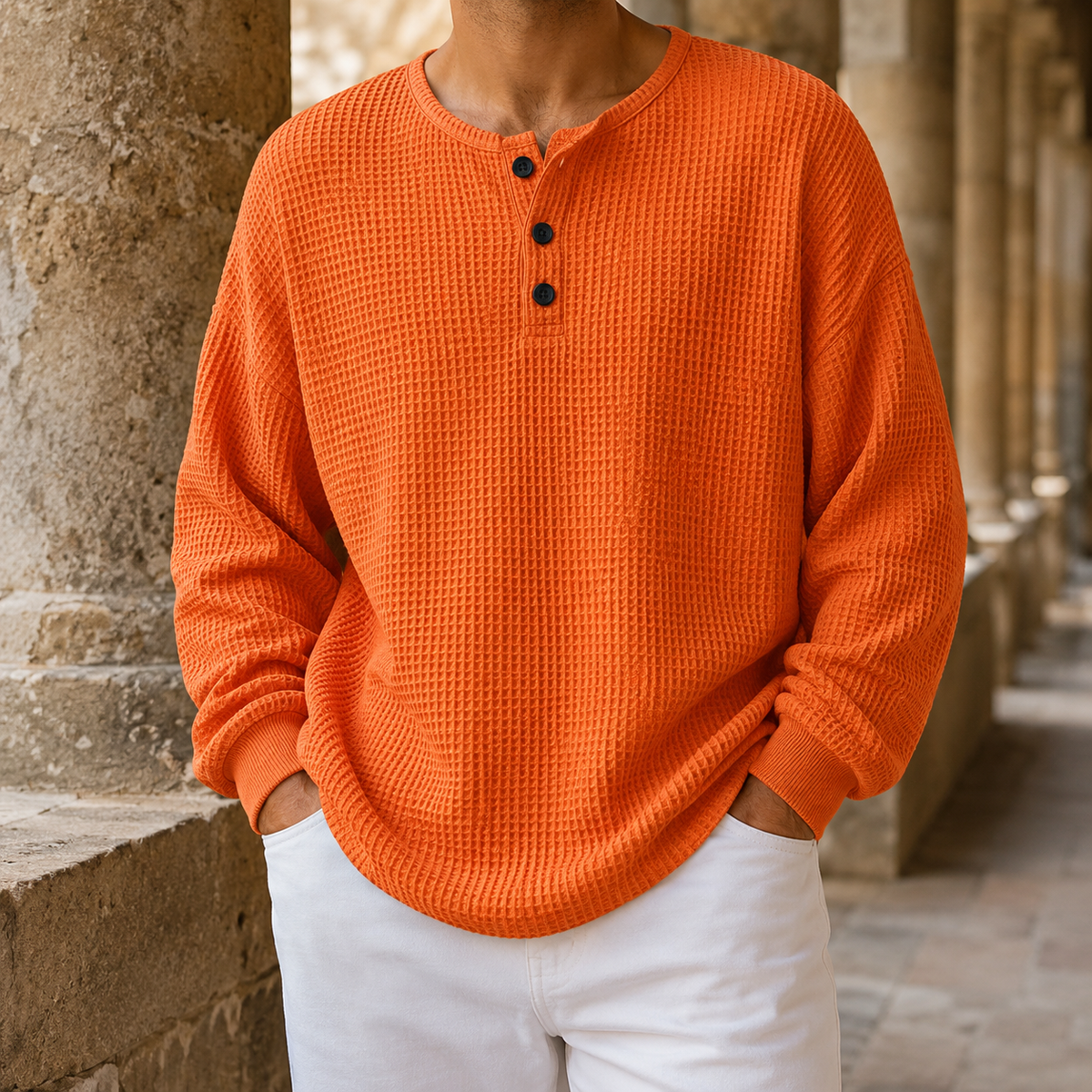 Front view of a men's relaxed-fit waffle knit Henley sweater