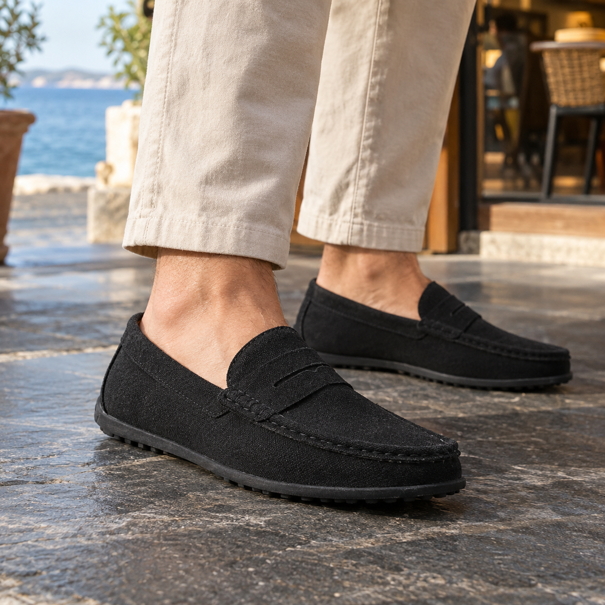 Leather penny loafers shown from a front three-quarter view