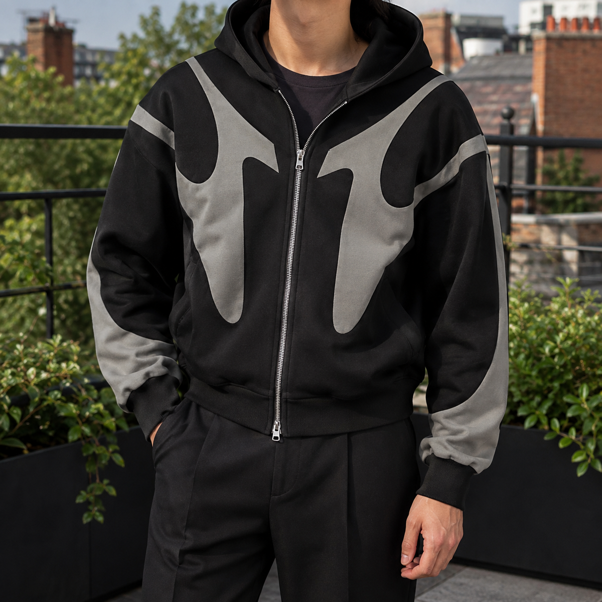 Men's contrast-panel full-zip hoodie shown from the front