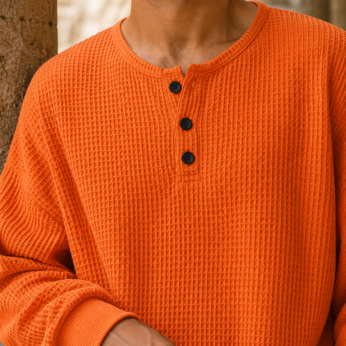 Close-up of the textured waffle knit fabric and button placket
