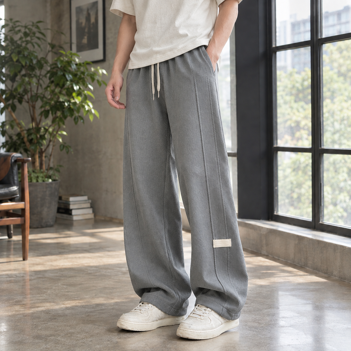 Close-up of the textured cotton blend fabric on wide leg pants