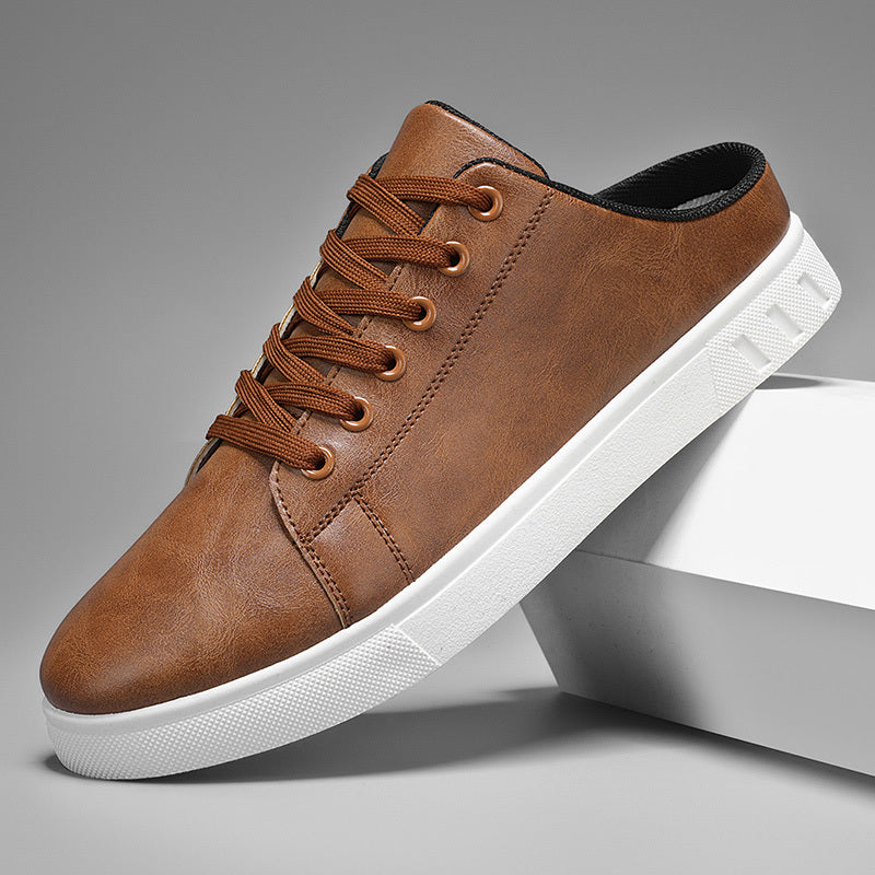 Leather lace-up mule sneakers with a white sole on a clean background