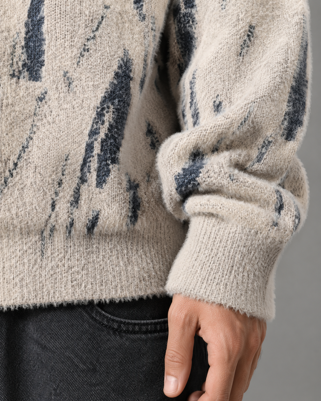 Side view highlighting the loose, comfortable fit of the knit sweater