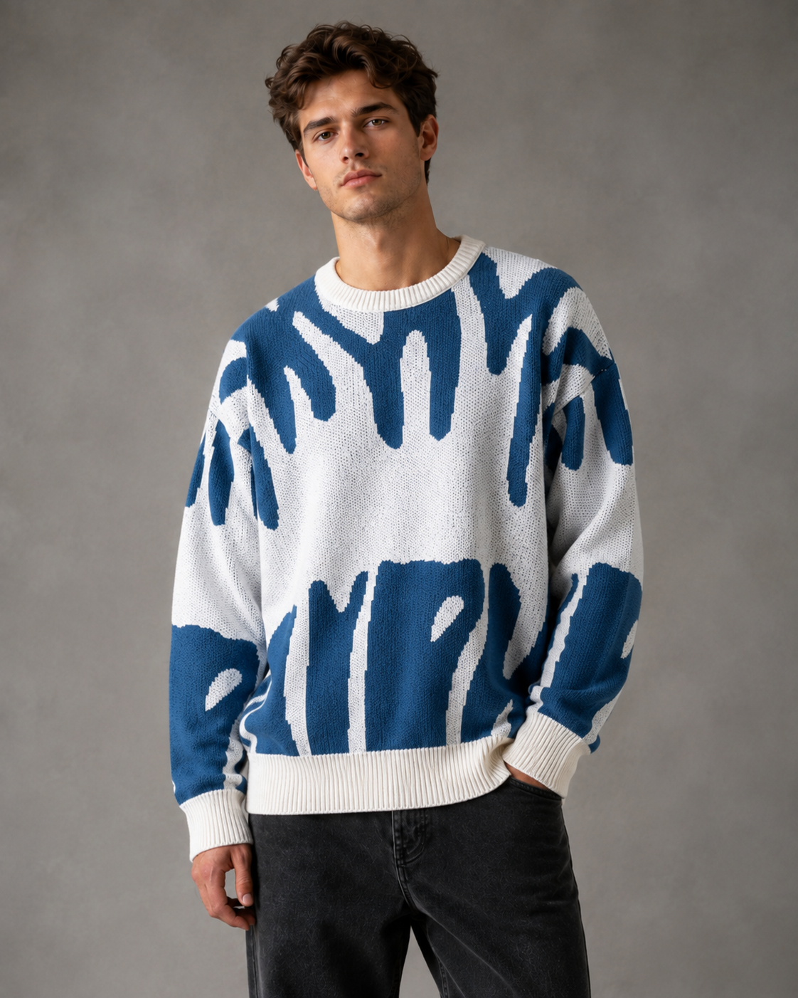 Detail of the dropped shoulder seam on a men's knit sweater
