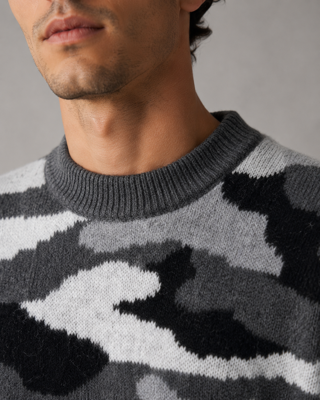 Side view of a men's camo knit crew neck sweater