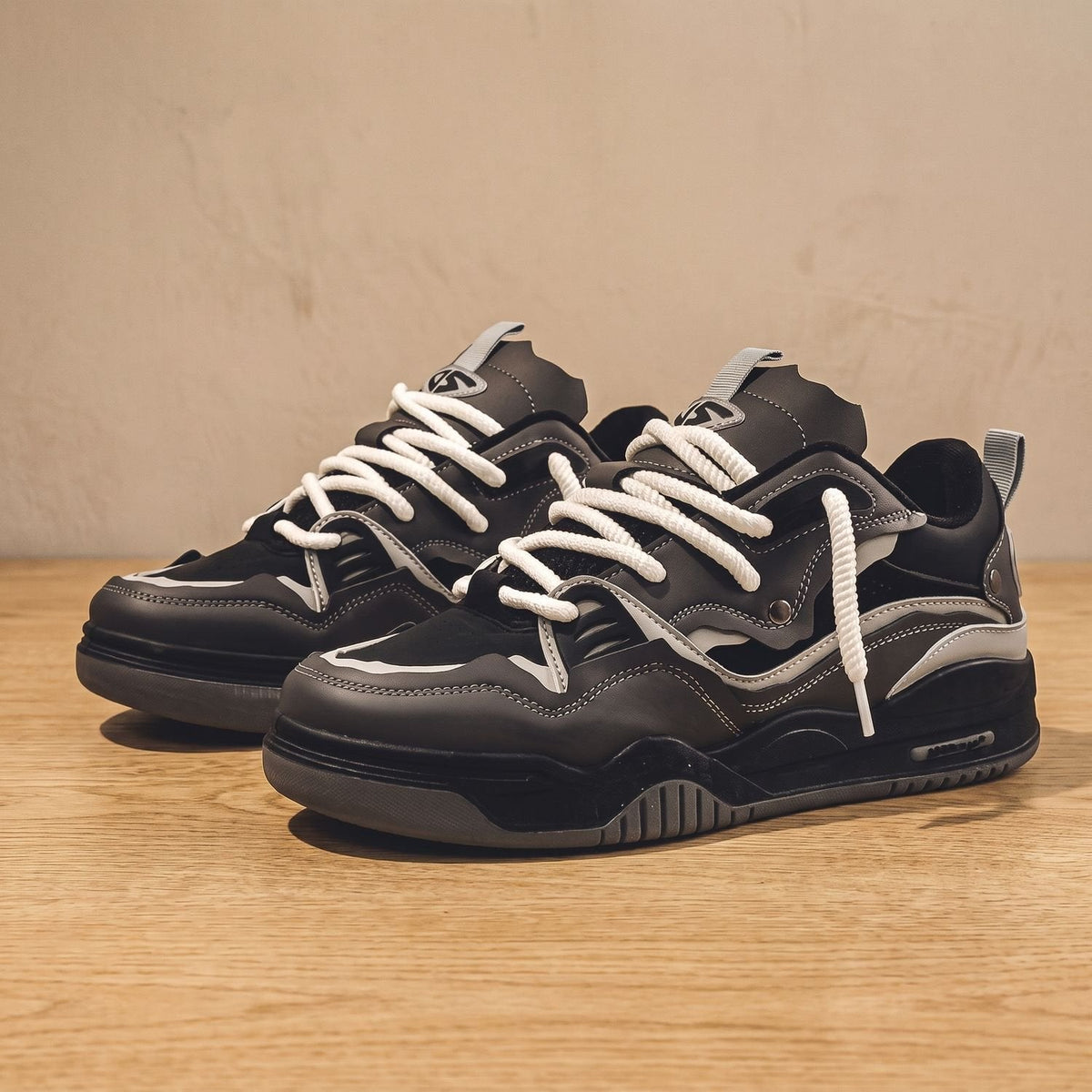 White and gray men's sneakers featuring a chunky rubber sole