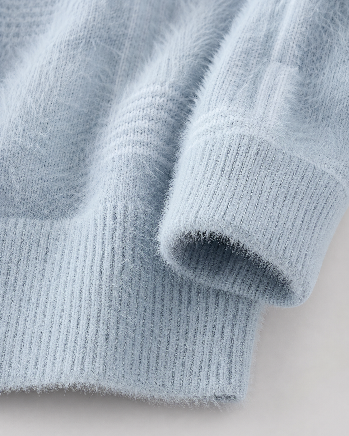 Side view of the relaxed-fit geometric knit sweater