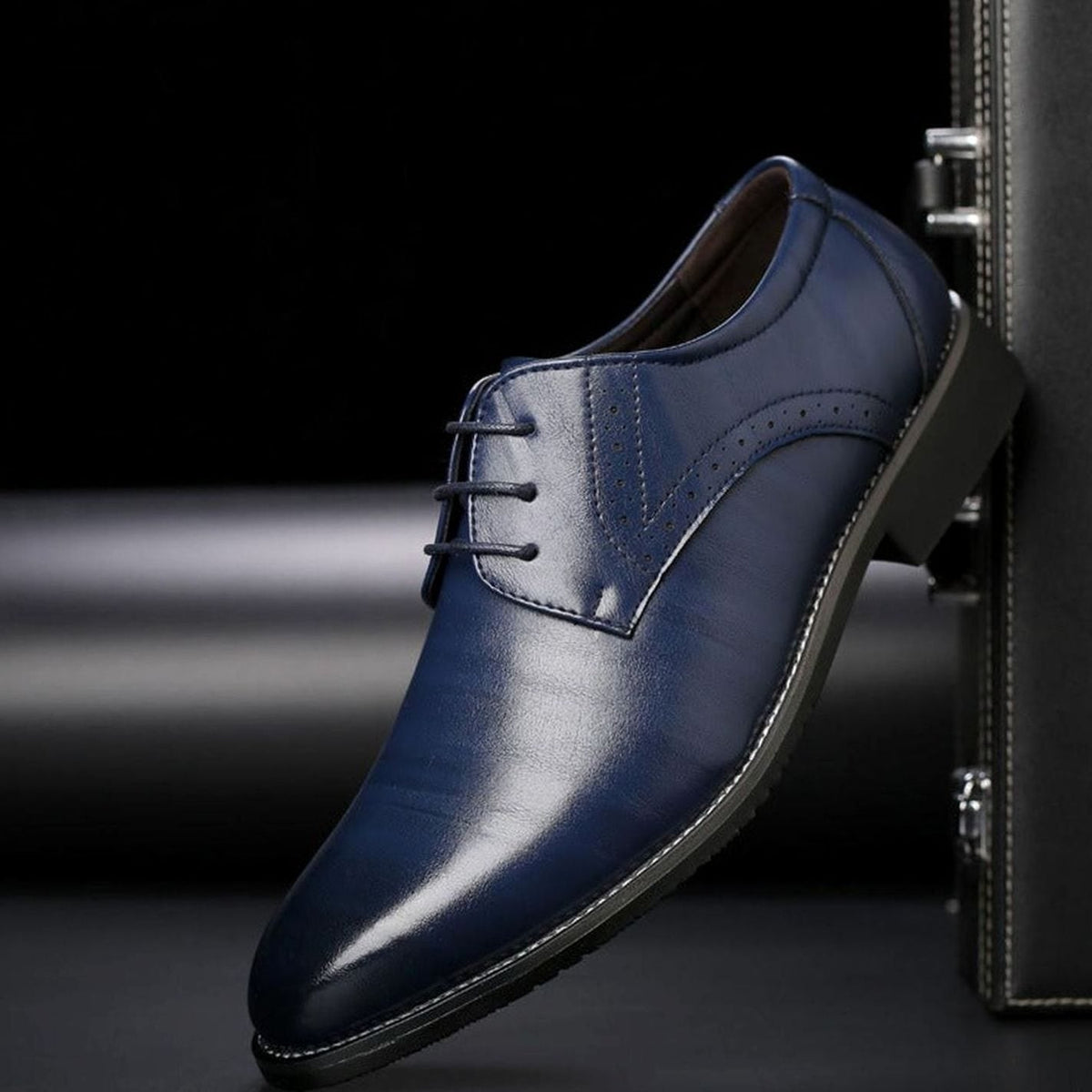 Close-up of the brogue perforated detailing and polished leather upper