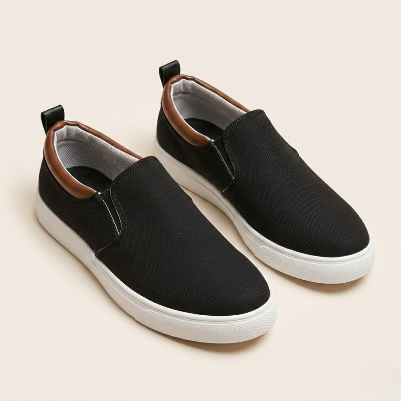 Pair of lightweight textile slip-on sneakers shown from the side
