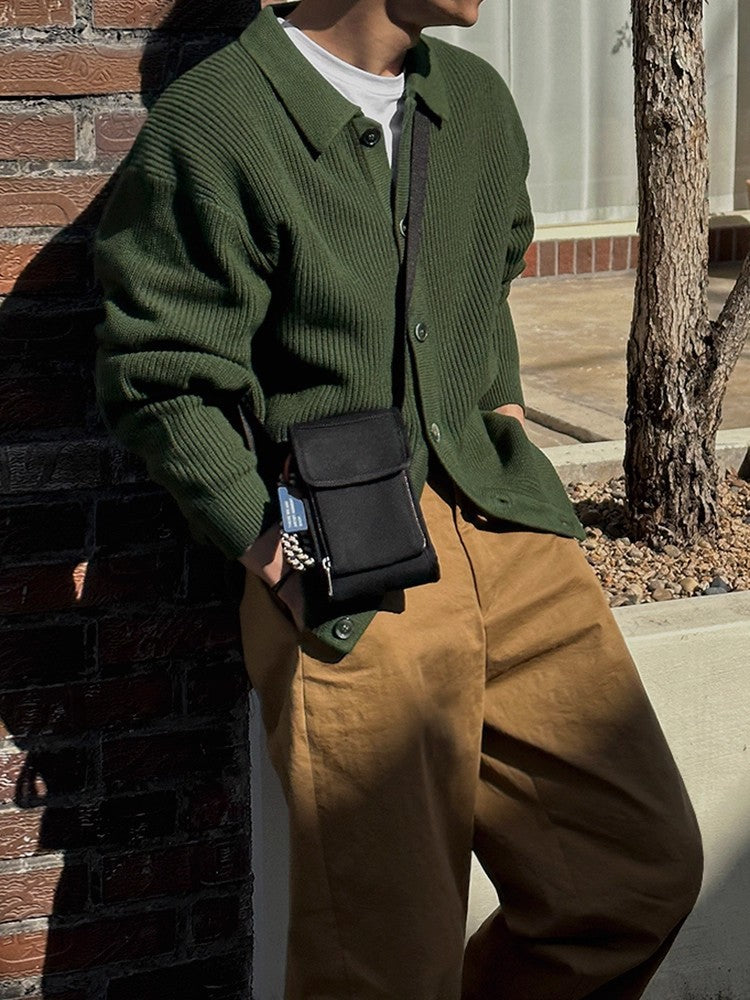 Women's ribbed cardigan showing its collared neckline
