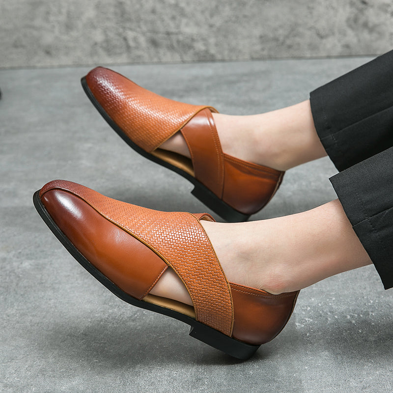 Pair of leather loafers displayed to show their structured shape