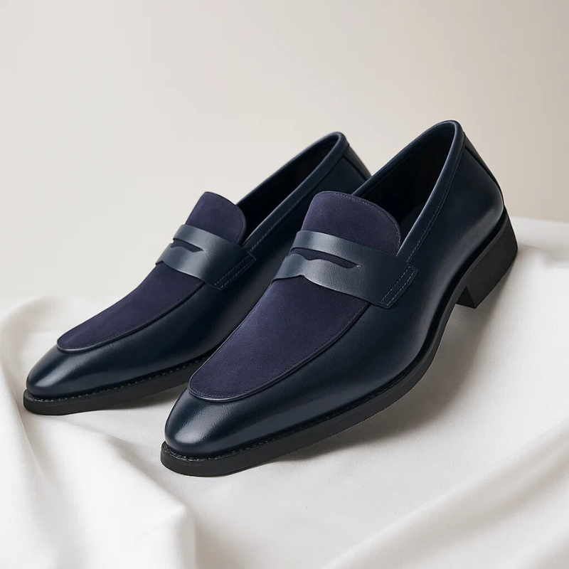 Classic leather penny loafers shown from a three-quarter angle