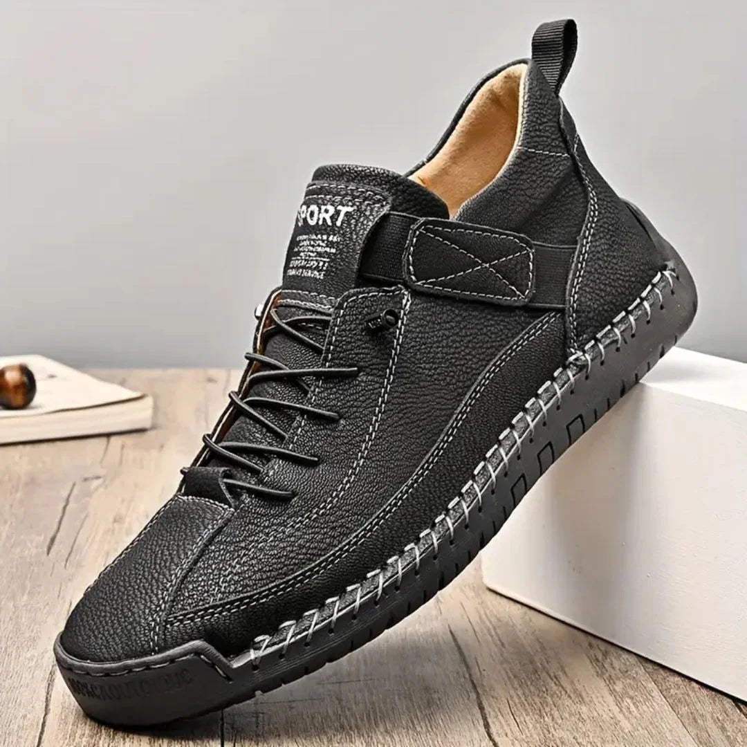 Pair of men's urban lace-up sneakers viewed from the side