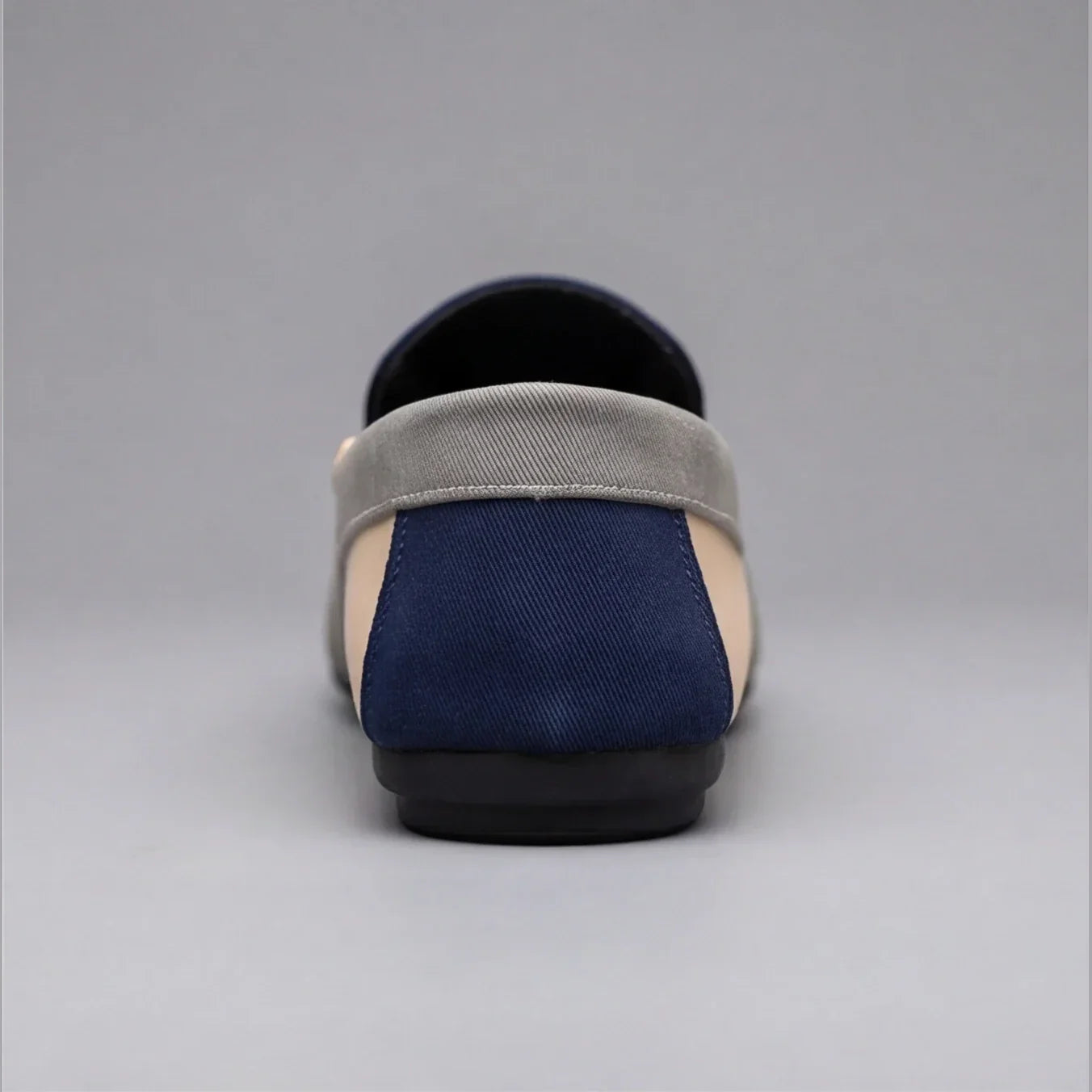 Pair of casual canvas loafers shown from the side