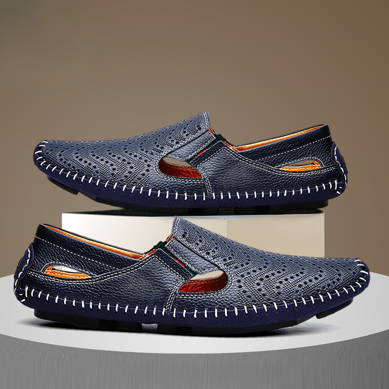 Close-up of the perforated leather straps on the sandals