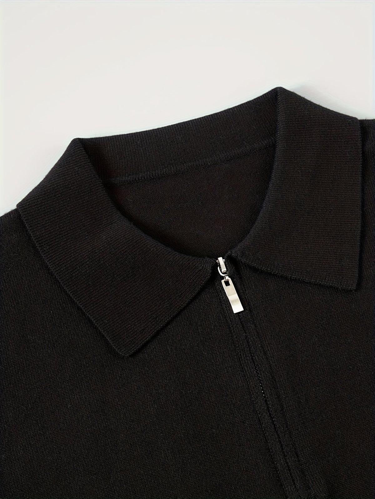 Detail of the ribbed collar on a men's polo sweater