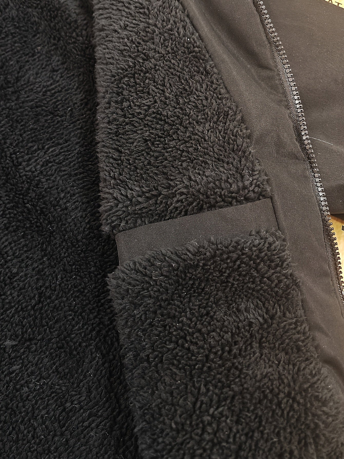 Warm lined parka worn for cold-weather outdoor comfort