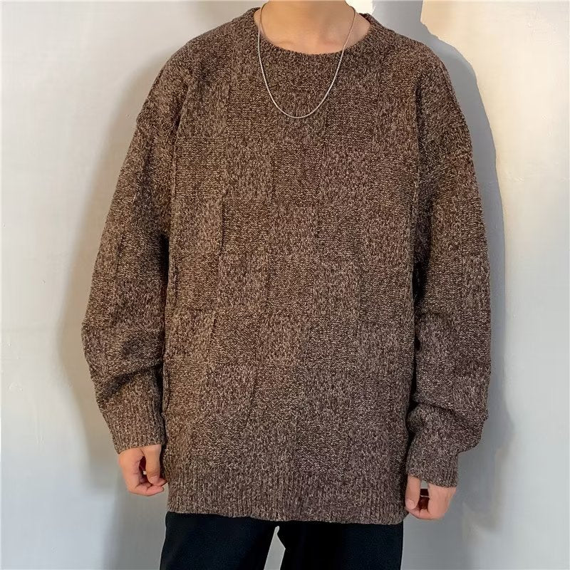 Close-up view of the diamond pattern knit texture on a men's sweater