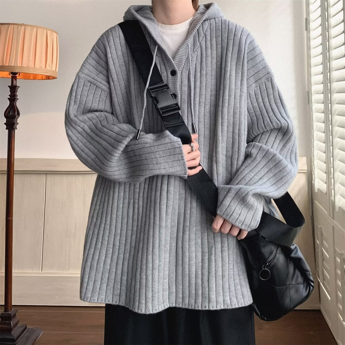 Open front men's cardigan with long sleeves shown in detail