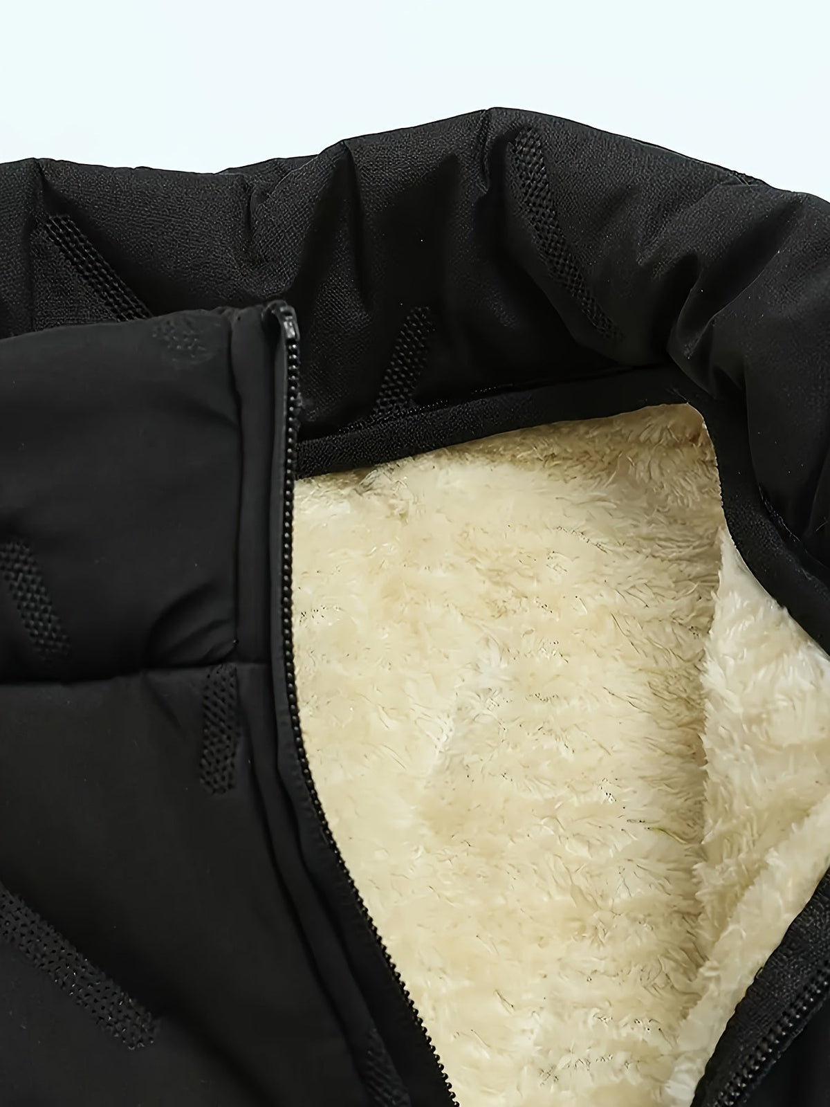 Side view of a men's quilted vest with a comfortable layered fit