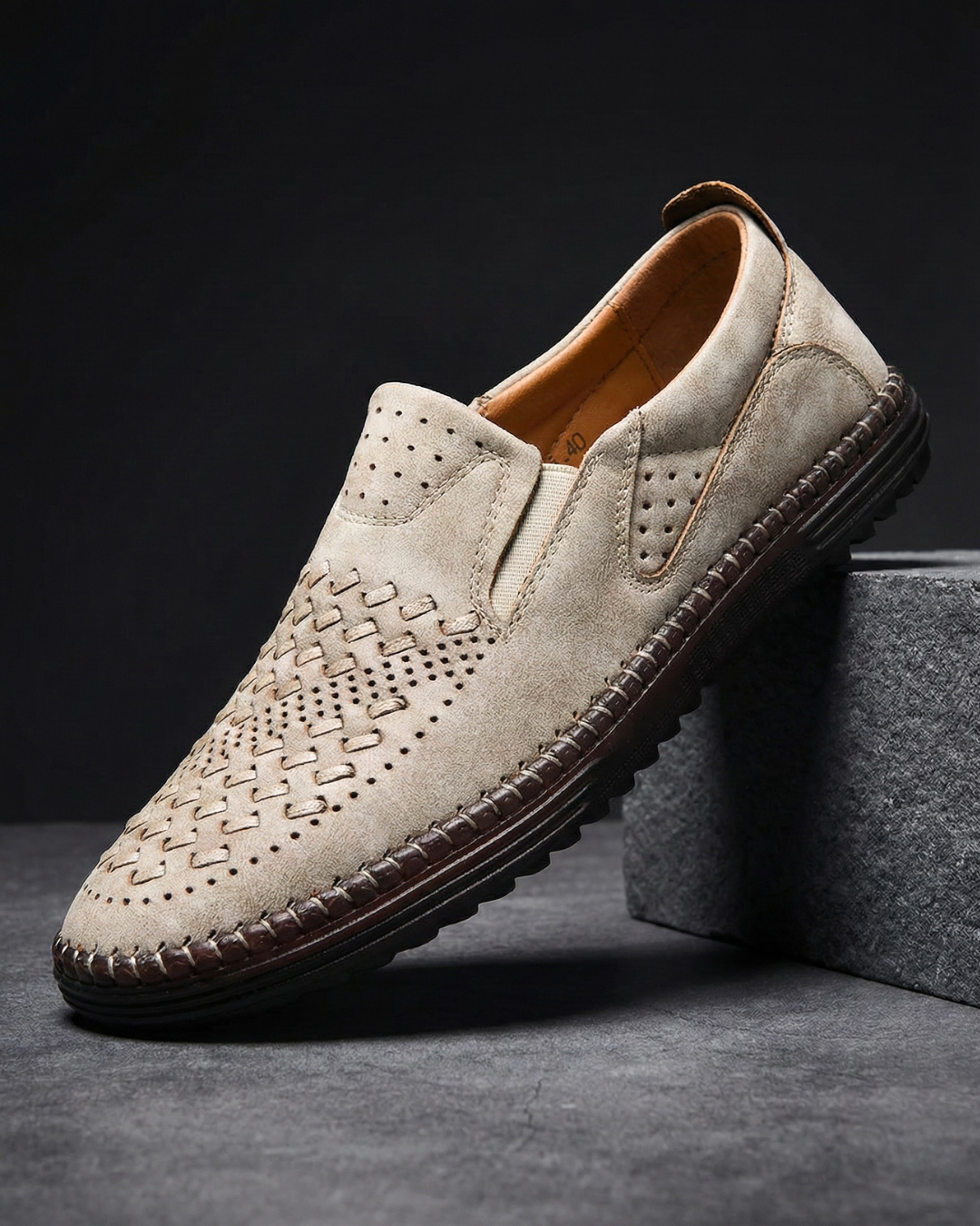 Side profile of leather loafers showing the slip-on design