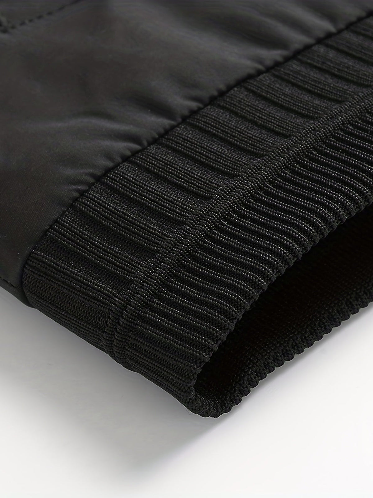 Close-up view of the classic bomber jacket fabric and overall construction.