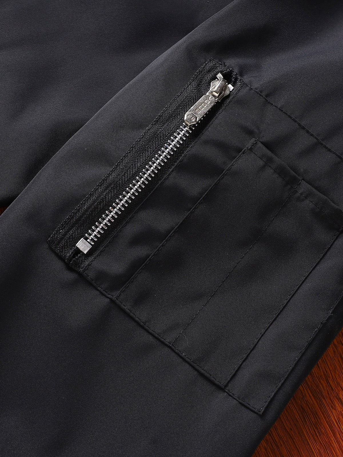 Classic bomber jacket shown at an angle for a versatile wardrobe look.