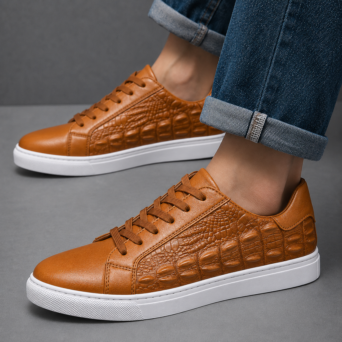 Close-up view of the crocodile texture on leather court sneakers